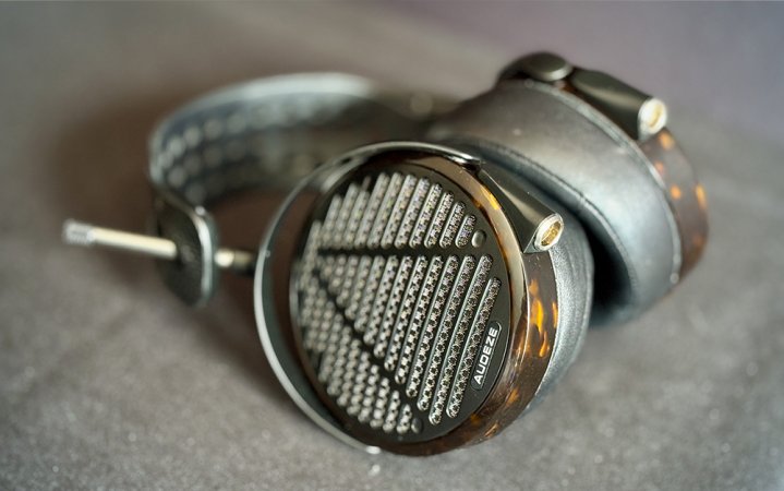  Audeze LCD-5 planar-magnetic headphones sitting on a great table