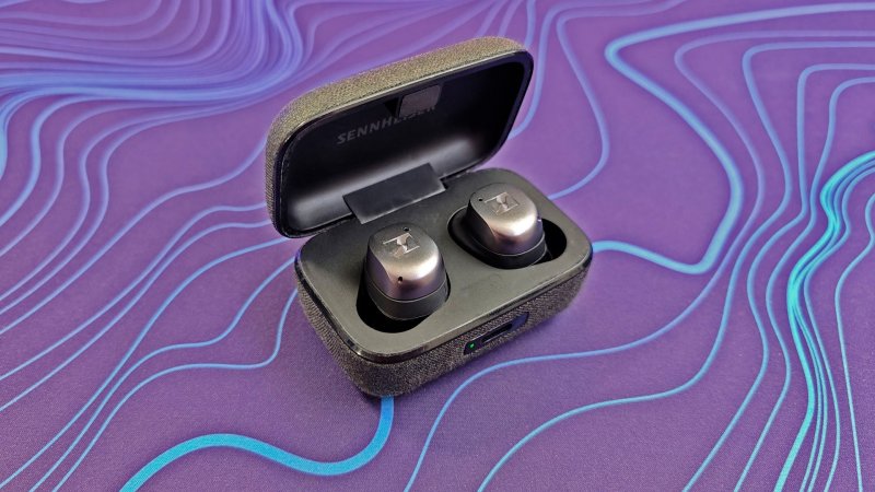  Sennheiser Momentum True Wireless 4 earbuds in their case on a purple deskpad