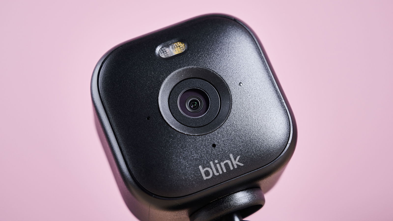 A close-up of the front of the Blink Mini 2, showing the camera and spotlight.